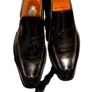Men black leather loafers with tassles.